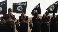 Isis suspect held