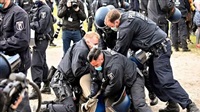 Swiss police violently