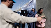 Aid Groups Pause