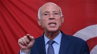 Tunisia's Saied appears,